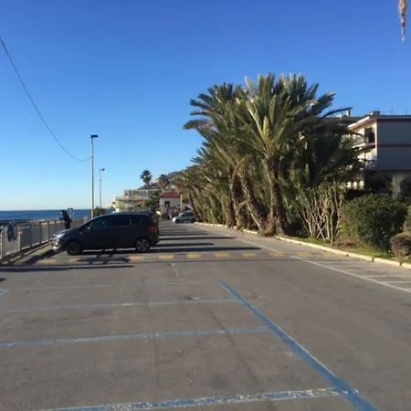 Family On Bike Path In Front Of The Beach